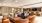 a clubhouse room with couches, chairs and a table