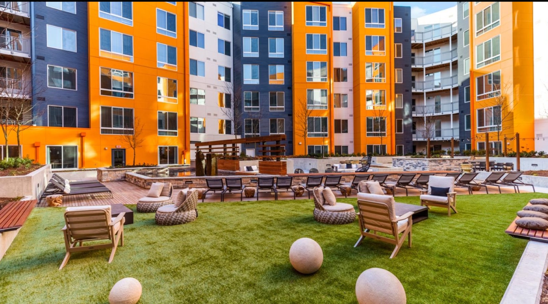 Quick access to state-of-the-art amenities a large courtyard area with chairs and tables