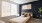 a bedroom with a bed and a chair