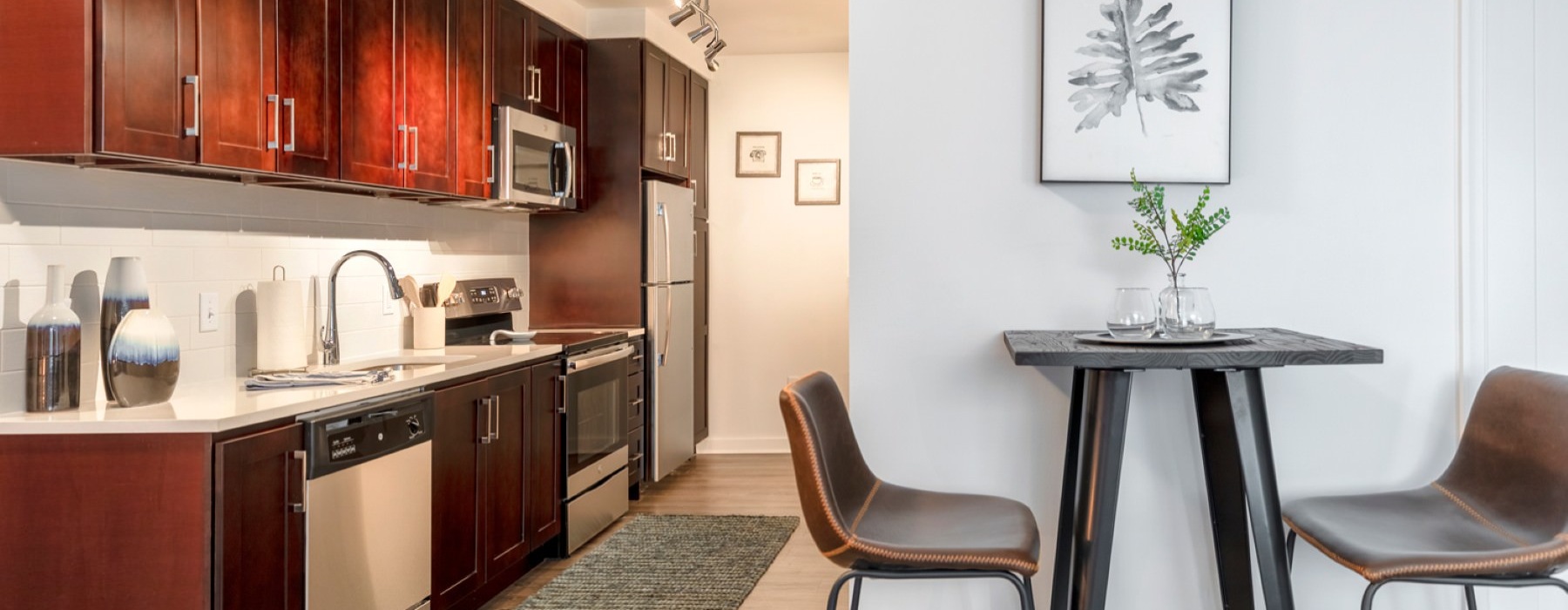 a kitchen with wooden cabinets