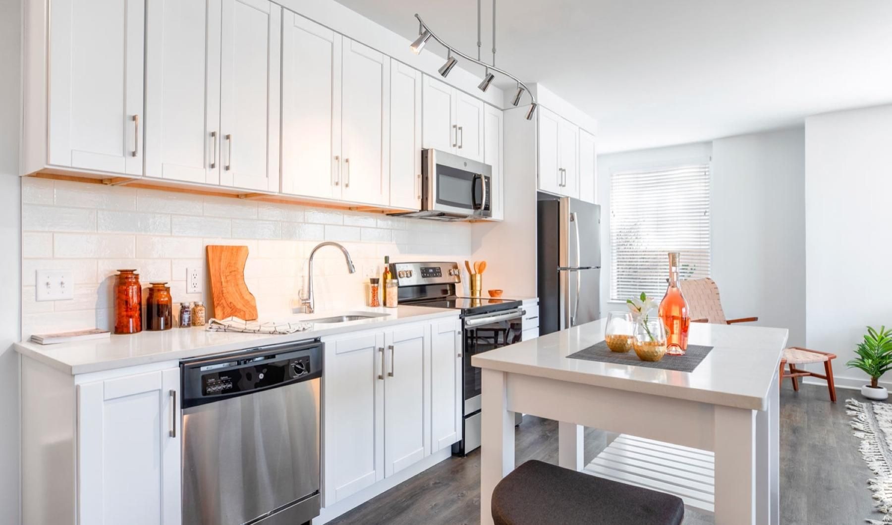 Spacious kitchens with thoughtful details a kitchen with white cabinets