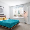 a bedroom with a bed and a desk