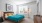 a bedroom with a bed and a desk