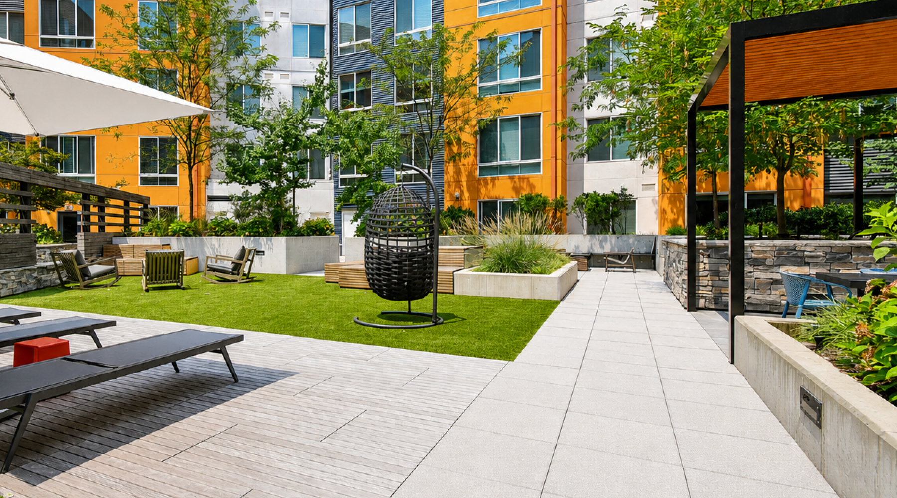 Landscaped outdoor courtyard with seating areas at Array at West Alex