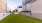 a grassy courtyard area between two buildings