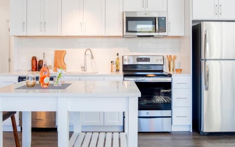 a kitchen with white cabinets