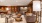 a clubhouse room with couches, chairs and lamps