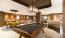 a pool table in a clubhouse room