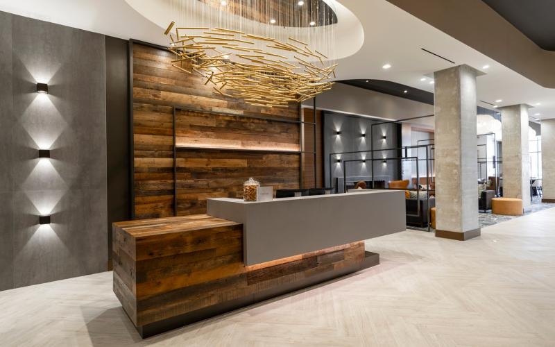 a leasing office front desk area with a chandelier
